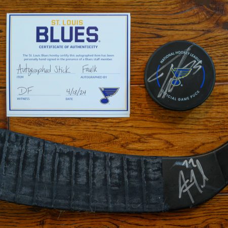 St. Louis Blues hockey puck and game-used hockey stick, autographed by Justin Faulk